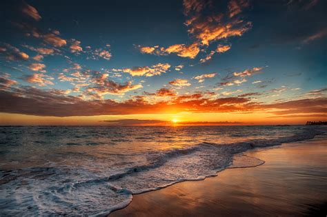 Sunrise Over The Beach Stock Photo - Download Image Now - iStock