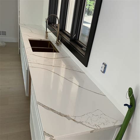 Featured Project: New Calacatta Laza Gold Quartz Countertops In New Hartford, NY | IVO Cabinets ...