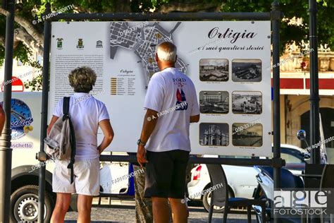 Syracuse, Sicily, Italy Tourist study a map or Ortygia or Ortigia ...