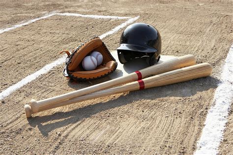 Baseball Glove, Balls, Bats And Baseball Helmet At Home Plate ...