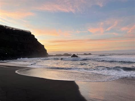 Sunset at a black sand beach : r/pics