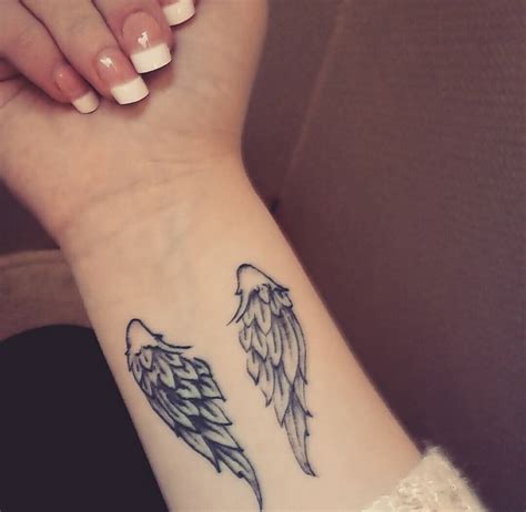 Small Angel Wings tattoo On Wrist