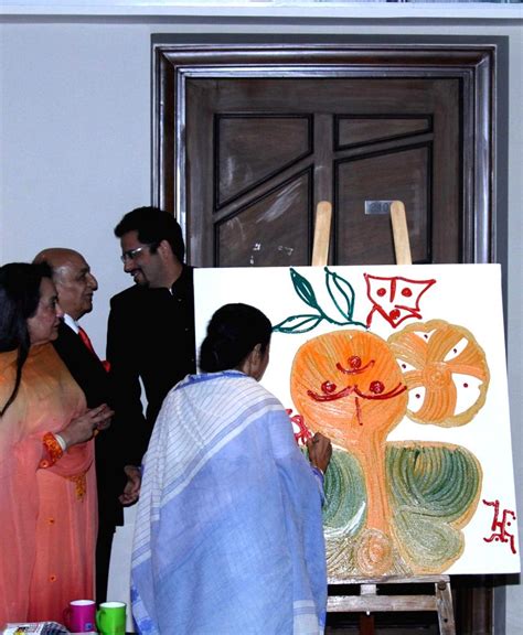 Mamata Banerjee paints during reopening ceremony of Lalit Great Eastern ...