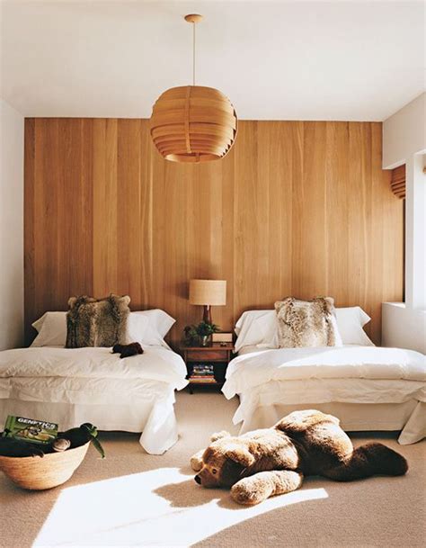 cute-shared-bedroom-with-wood-paneling-wall | HomeMydesign