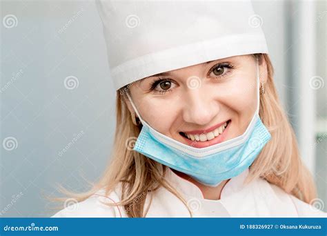 Portrait of Smiling Doctor or Nurse with Lowered Medical Mask Stock ...