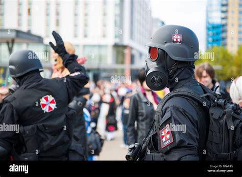 LONDON, UK - OCTOBER 26: Cosplayers dressed as Umbrella Corporation's soldiers from the film ...