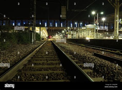 Train Tracks At Night Stock Photo - Alamy