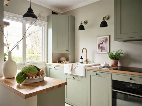 Sage green kitchen cabinets in a green color palette apartment - COCO LAPINE DESIGNCOCO LAPINE ...