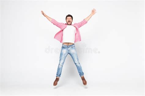 Excited Young Man Jumping and Smiling Isolated on White Background Stock Photo - Image of hiphop ...