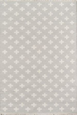 a gray and white rug with crosses on it