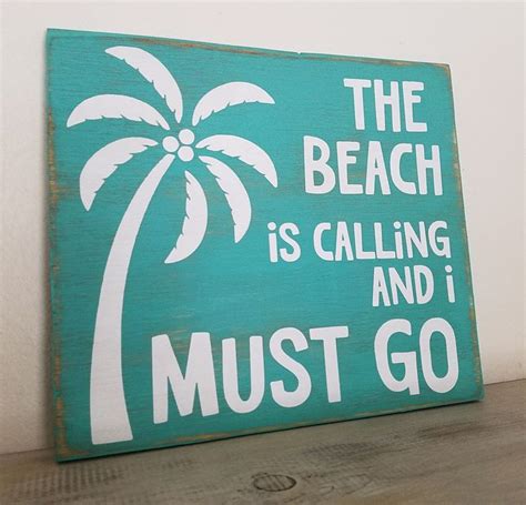 a sign that says the beach is calling and i must go