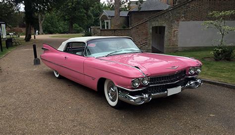 Iconic 1959 Pink Cadillac convertible with White roof