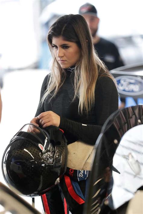 Hailie Deegan adjusts her helmet in her garage before the start of a practice session during ...