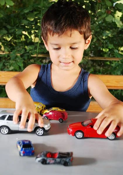 Children playing with cars toys outdoor in summer time — Stock Photo ...