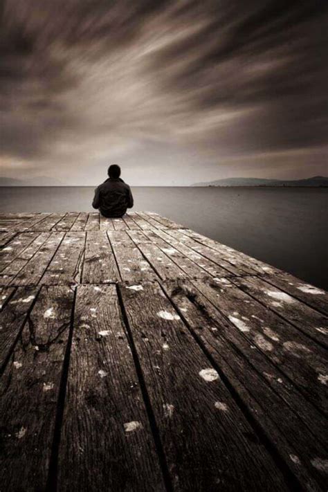 Download Alone Sad Man On Lake Portrait Picture | Wallpapers.com