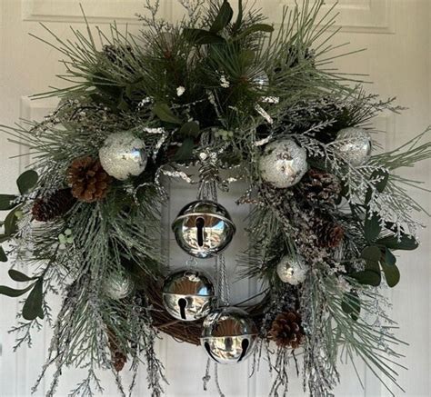 Christmas Wreath With Shiny Silver Bells, Icy Everygreen Foliage, Pinecones and Mistletoe, Icy ...