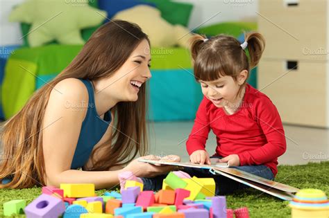 Mother and toddler playing together ~ Education Photos ~ Creative Market