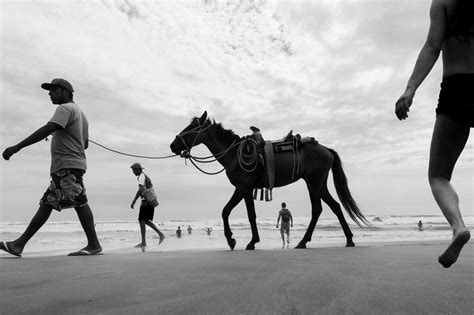 Dramatic Perspectives Capture Uniquely Juxtaposed Beachgoers in Street ...