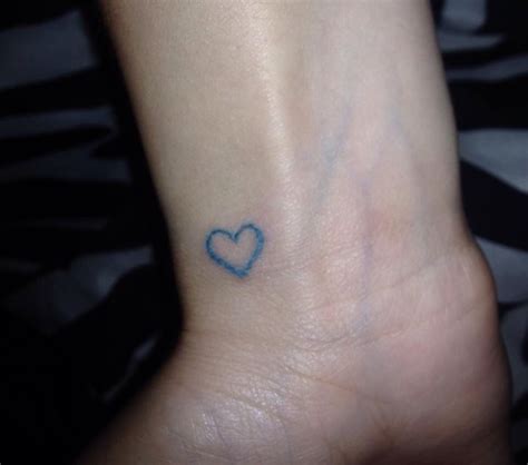 Blue heart wrist tattoo. My boyfriends favorite color. | Heart tattoo wrist, Small heart tattoos ...