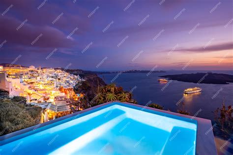 Premium Photo | Amazing evening landscape of fira, infinity pool ...