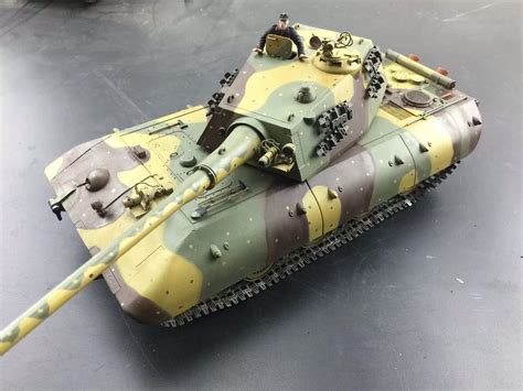 a toy army tank sitting on top of a table