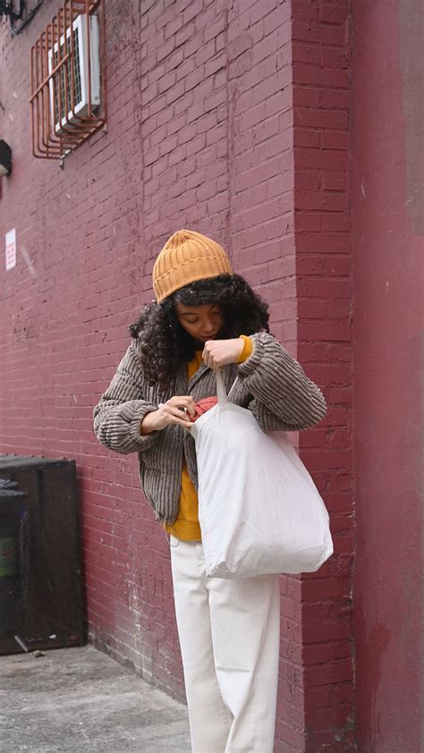 A Woman Looking Through Stuff in her Tote Bag · Free Stock Video