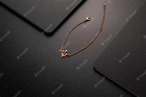 Premium Photo | Gold jewellery necklace on black background