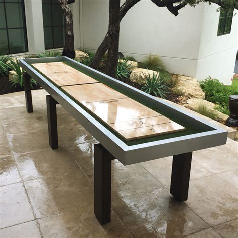 Play outdoors on this weather-proof shuffleboard. The rock-solid ...