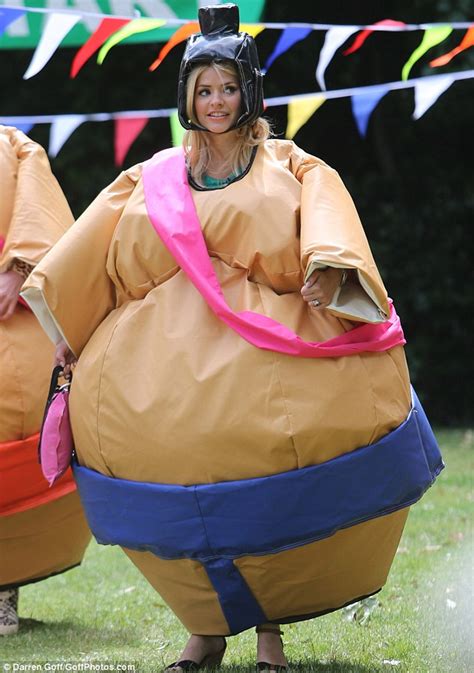 Holly Willoughby wobbles in a giant sumo wrestling suit as she completes against Phillip ...