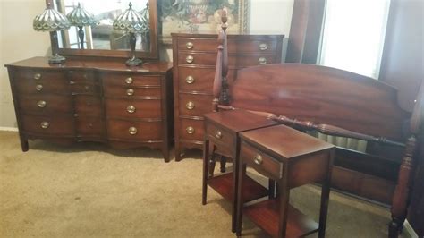 I have a 1950s dixie mahogany bedroom set. Dresser with mirror, chest, 4 poster bed with ...