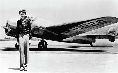 Amelia Earhart with Lockheed Electra 10E Photograph by Aviation History ...
