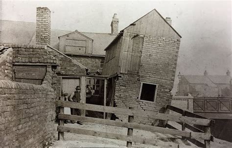 an old black and white photo of a house