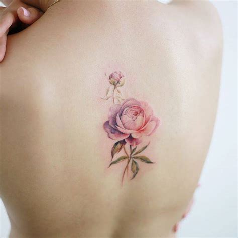 Pink rose tattoo on the back.