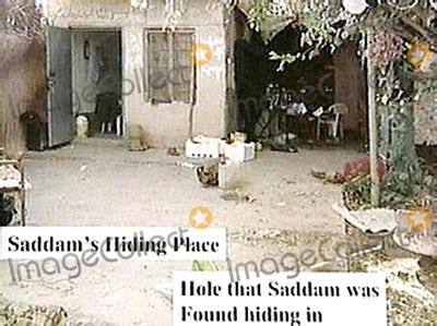 Photos and Pictures - U.s. Soldiers Demonstrate Access to the Spider Hole Used by Saddam Hussein ...