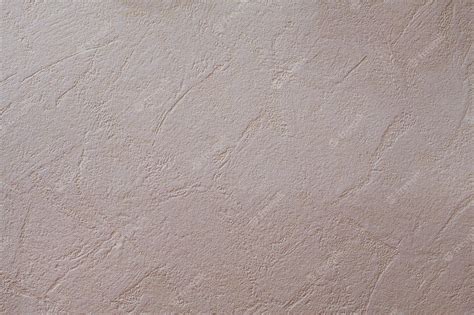 Premium Photo | A beige wall with a pattern of lines and curves.