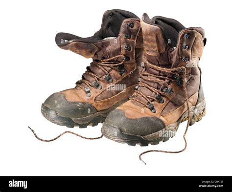 Old muddy hiking boots on white, isolated Stock Photo - Alamy