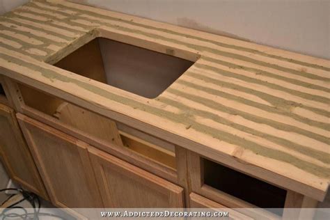 DIY butcherblock style countertop - cracks filled with wood filler #kitchencountertopsstyling in ...