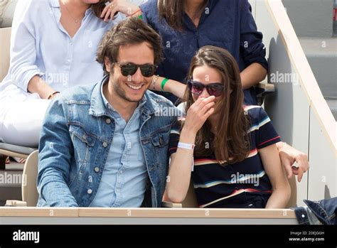 Vianney and his girlfriend Catherine Robert in stands during French ...