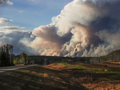 Convoy leads Canada fire evacuees through burning city to safety ...