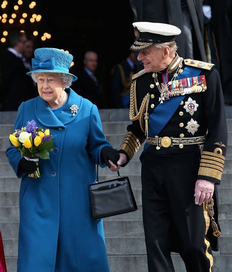 Prince Philip and Queen Elizabeth II held hands as they left London's ...