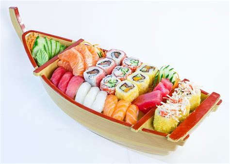 a boat filled with lots of different types of sushi