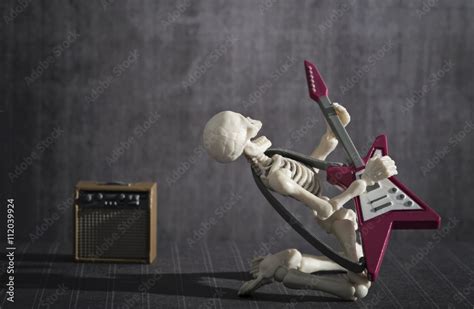 A Skeleton playing rock electric guitar Stock Photo | Adobe Stock