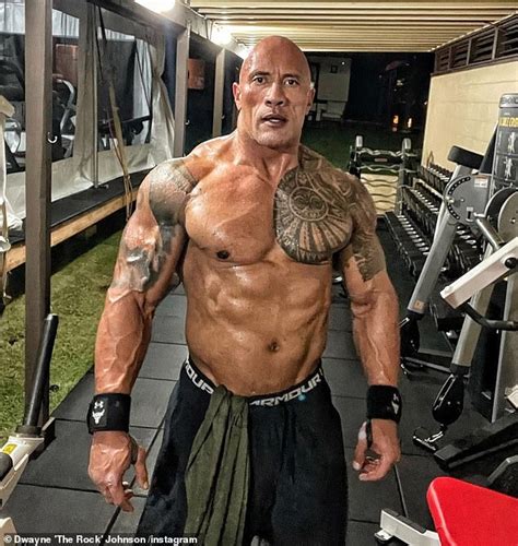 Dwayne 'The Rock' Johnson goes shirtless as he shows off his bulging muscles | Daily Mail Online