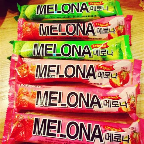 five packets of melona are stacked on top of each other in front of a wooden table