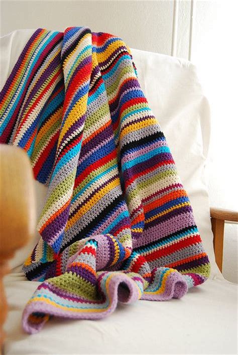 I crocheted a baby blanket like this, except I used pastel colours, with a silk twist running ...