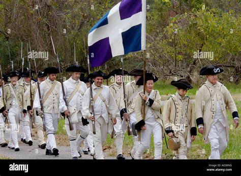 French army reenactors march to the surrender ceremony at Yorktown Virginia 1781. Digital ...