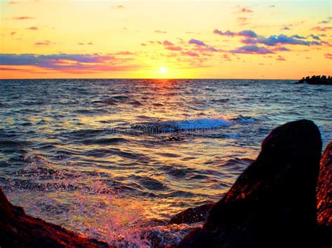 Sunrise Seen from the Rocks Stock Photo - Image of cloudy, local: 265605258