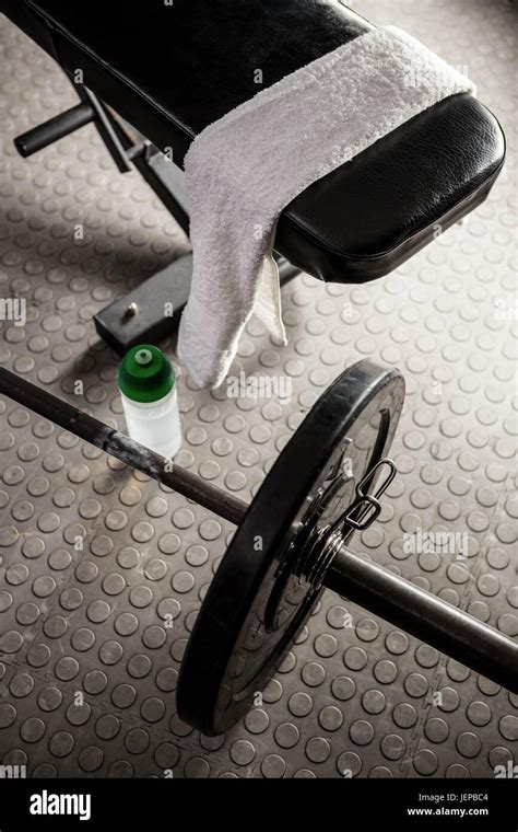 Bench and barbell Stock Photo - Alamy