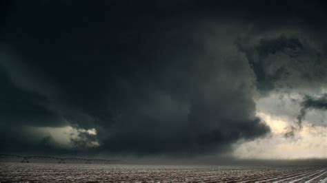 TORNADO? Nope! This scary sight was actually a harmless wall cloud that condensed fully to the ...