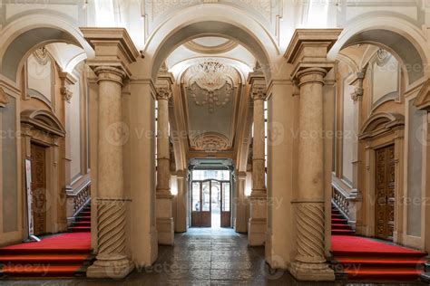 Turin, Italy - Palazzo Barolo staircase. Luxury palace with old baroque interior and red carpet ...